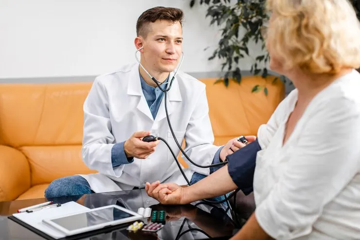 doctor checking patient